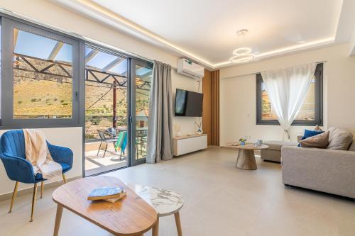 a living room with a couch and a table at Villa Bianca with Jacuzzi in Gouves