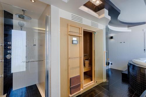 a bathroom with a shower and a sink at Damianii Luxury Boutique Hotel & Spa in Omiš