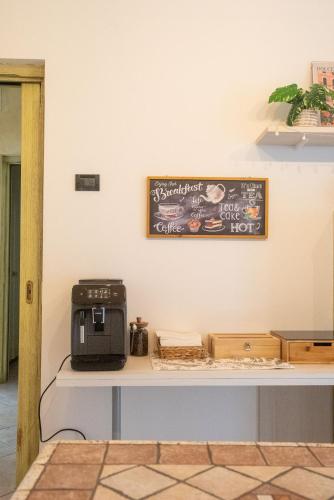 a counter with a toaster and a microwave on it at Villa Sun Kiss in Volta Mantovana