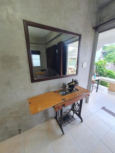 a bathroom with a sink and a mirror on the wall at large jacuzzi and charming home center of old city in Chiang Mai