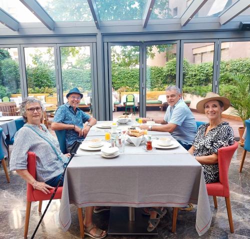 a group of older people sitting around a table at Ada Suites Nisantasi in Istanbul