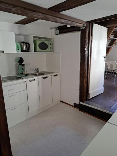 a kitchen with a sink and a microwave at 1463 Apartmenthaus in Karlsruhe