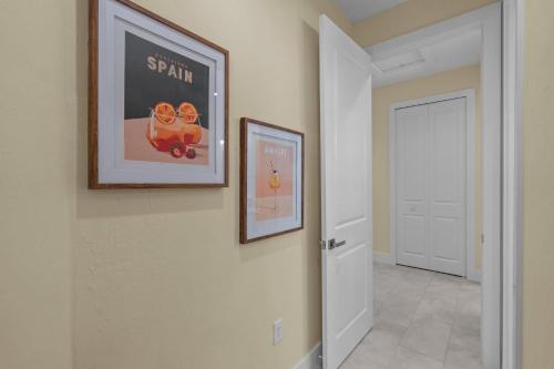 a hallway with a picture on the wall and a door at new everything - walk to everything in Fort Myers Beach