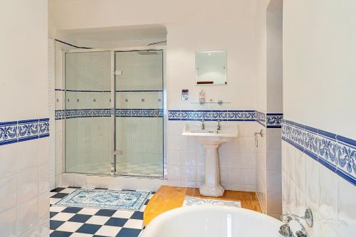 a bathroom with a shower and a sink and a tub at Finest Retreats - The Old Rectory in Tring