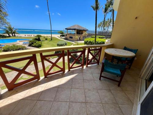a balcony with a view of the beach and the ocean at Agualina Kite Hotel Oceanfront Apartments in Cabarete