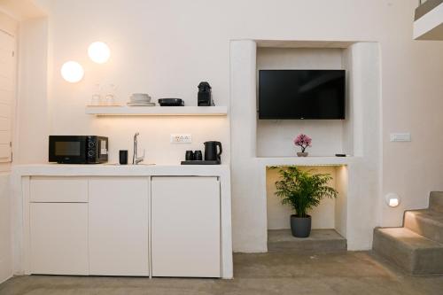 Naos Suitesにあるキッチンまたは簡易キッチン