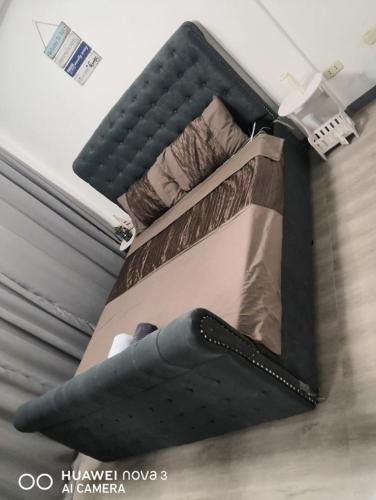 a suitcase on top of a bunk bed at Modern Bahay Kubo in Calaca