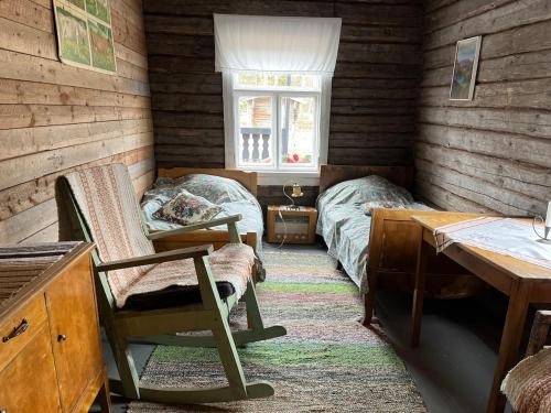 Postel nebo postele na pokoji v ubytování Vintage atmospheric log house