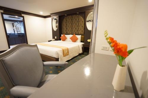 Ένα ή περισσότερα κρεβάτια σε δωμάτιο στο King Park Avenue Hotel Bangkok