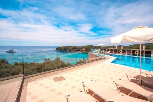a villa with a swimming pool and a view of the ocean at Valtos View in Parga