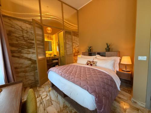 a bedroom with a large bed in a room at Hotel Lost Ashrafieh in Beirut