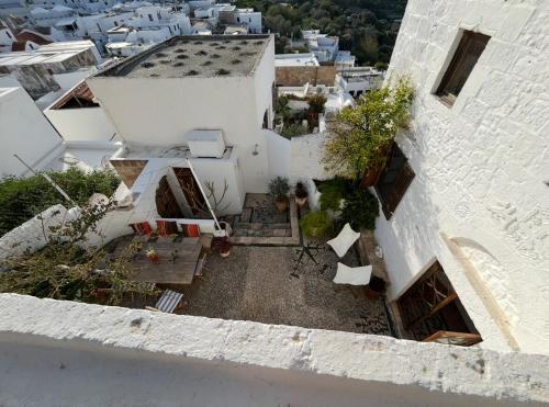 an aerial view of a white building with plants at Villa Kali in Líndos