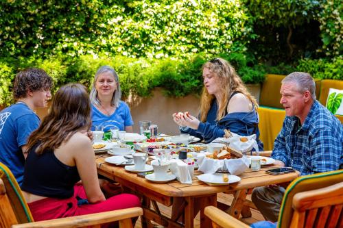 a group of people sitting at a table eating food at Ada Suites Nisantasi in Istanbul