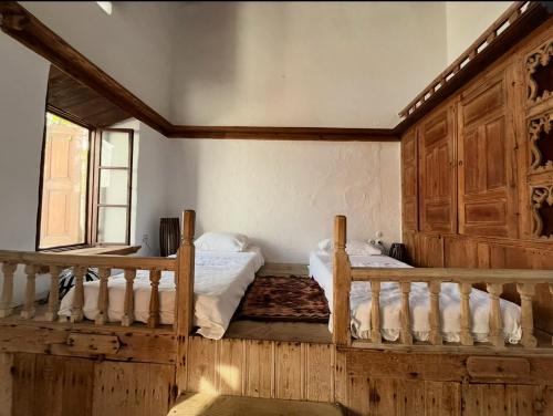 a bedroom with two bunk beds and a window at Villa Kali in Líndos