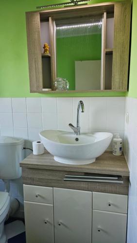 a bathroom with a sink and a toilet at Apartment Ferienwohnung Mali Duisburg Süd voll möbliert Urig near Autobahn Ubahn in Duisburg