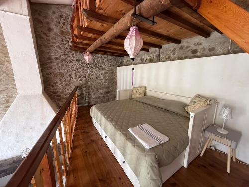 a bedroom with a large bed in a attic at Wood Lodge - Sleeps10 - Skiing - Thermal Baths in Los Masos