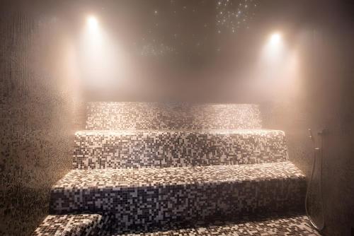 a set of stairs in a room with lights at Appartement spa fleures d'Orelle in Orelle