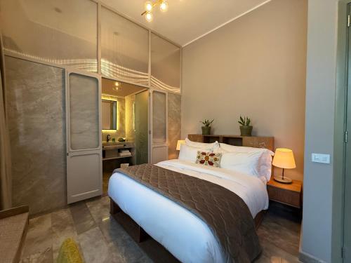 a bedroom with a large bed in a room at Hotel Lost Ashrafieh in Beirut