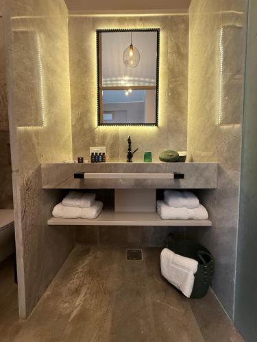 a bathroom with a sink and a mirror at Hotel Lost Ashrafieh in Beirut