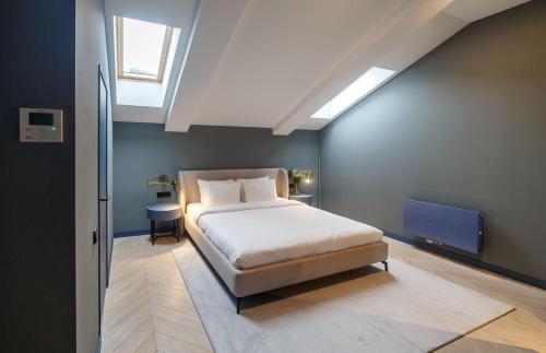 a bedroom with a bed and a television in it at Lion's Castle Hotel in Lviv