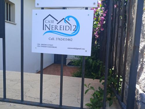 a sign in front of a building at Case Nereidi 3 in Porticello