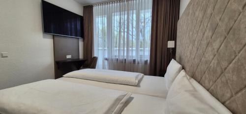 Melvi Hotel Göppingenにあるベッド