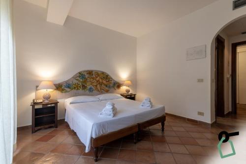 Letto o letti in una camera di HOTIDAY Room Collection - Taormina