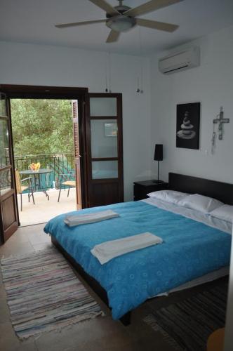 Кровать или кровати в номере Poli Home