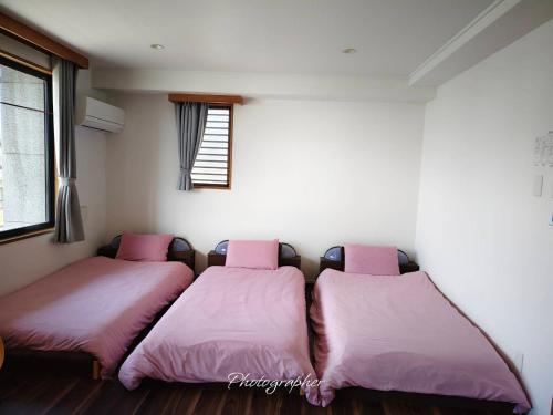 Postel nebo postele na pokoji v ubytování Guest House WA