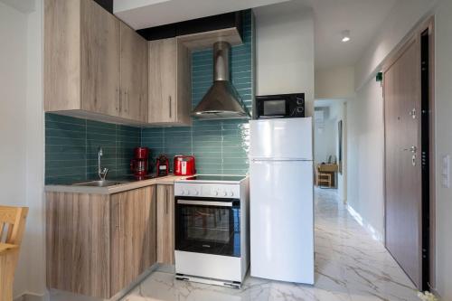 Η κουζίνα ή μικρή κουζίνα στο Pomegranate Apartments
