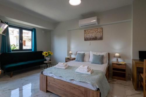 Ένα ή περισσότερα κρεβάτια σε δωμάτιο στο Pomegranate Apartments