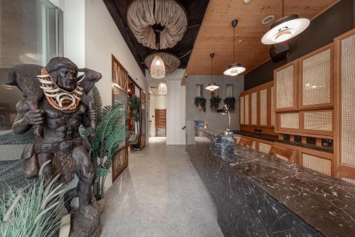 a hallway with a large statue of a man at Sun Moon Lake ItaThao Vacation Inn with Elevator in Yuchi