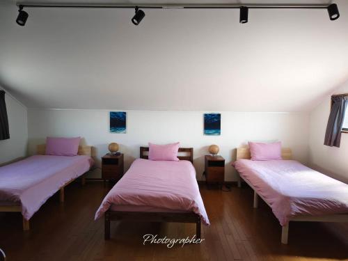 Postel nebo postele na pokoji v ubytování Guest House WA