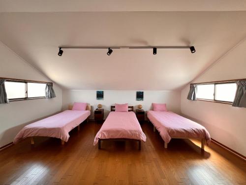 Postel nebo postele na pokoji v ubytování Guest House WA