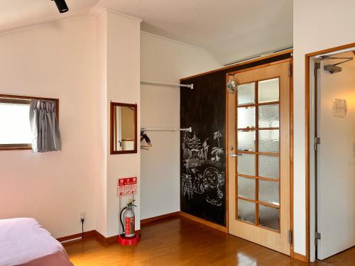 Postel nebo postele na pokoji v ubytování Guest House WA