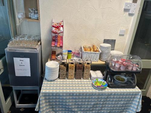 a table with a blue and white table cloth with food at The Hurstmere in Blackpool