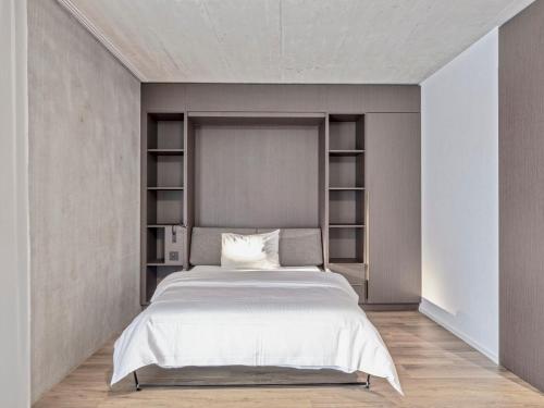 Ένα ή περισσότερα κρεβάτια σε δωμάτιο στο MOOI Apartments St.Gallen