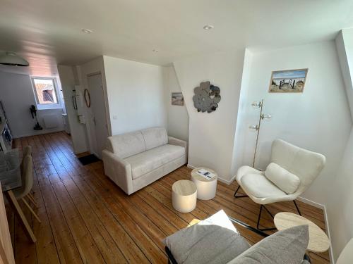 Posezení v ubytování Le Duplex Appartement