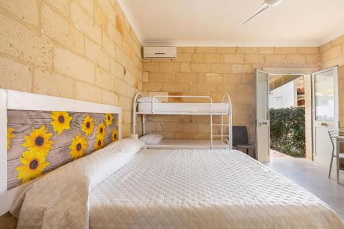 Voodi või voodid majutusasutuse Le Dimore del Mare by BarbarHouse toas