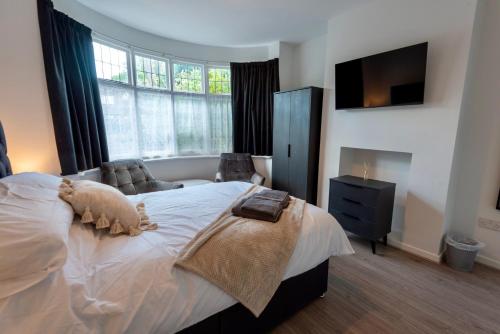 a bedroom with a bed with a teddy bear on it at Single room in brand new 5 bedroom home BW Room 2 in Olton