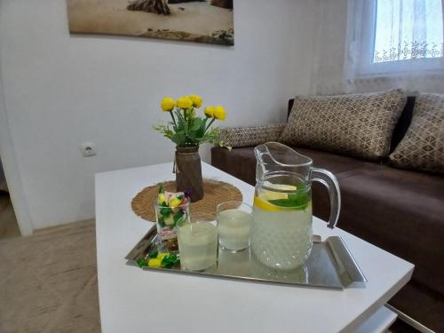 a coffee table with a tray with drinks on it at MaxRelax in Mostar