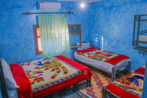 Una cama o camas en una habitación de Auberge Toubkal