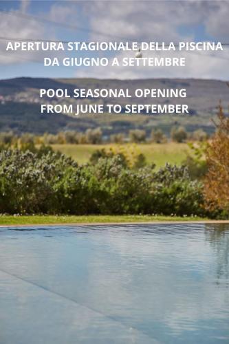 a view of a body of water with the words pool seasonal operating from j at Hotel Villa Il Patriarca in Chiusi