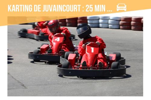 a group of people riding in a race car at Gîte de l'Abbaye de l'Étanche in Rollainville
