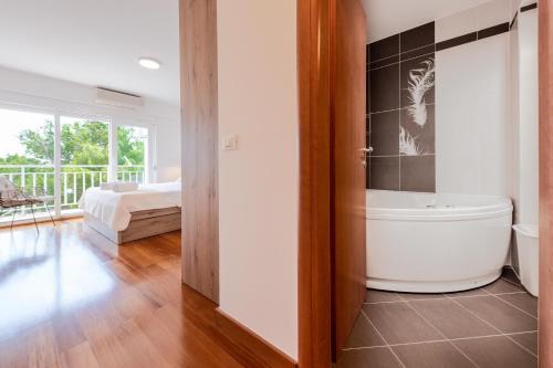 Posteľ alebo postele v izbe v ubytovaní Apartman Zdravka