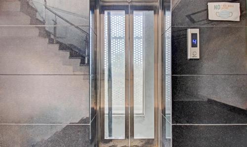 a glass door with a sign on the side of a building at Treebo Silver Grand in Lucknow