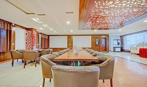 a conference room with tables and chairs in a room at Treebo Silver Grand in Lucknow