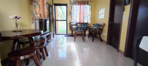 a dining room with a table and chairs at Affordable Whole House Rent Transient in Butuan