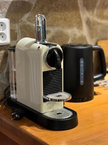 a toaster sitting on top of a wooden table at Chata Alšovka in Měděnec