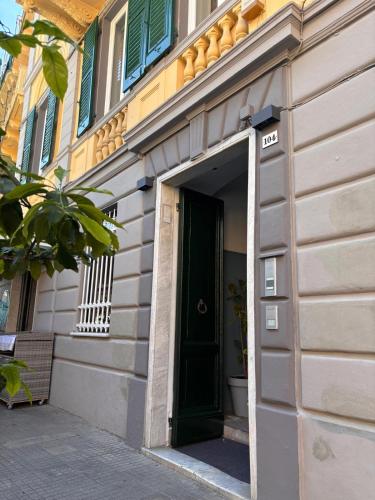an entrance to a building with a green door at Dimore di Mare in Arenzano